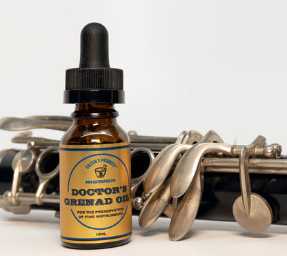 Grenad Oil product shot next to clarinet